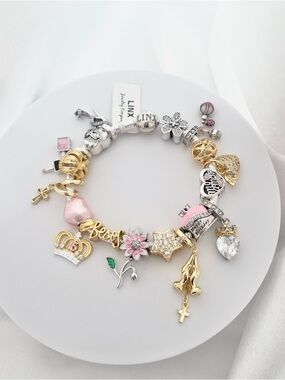 Linx Yellow Gold Bracelet with Gold Silver and Pink Quinceanera Charms